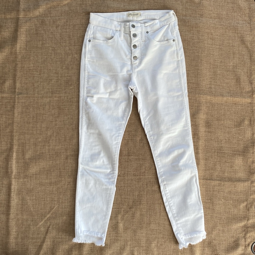 Madewell 10” high rise skinny jeans size 27. Frayed hem and no marks or stains.